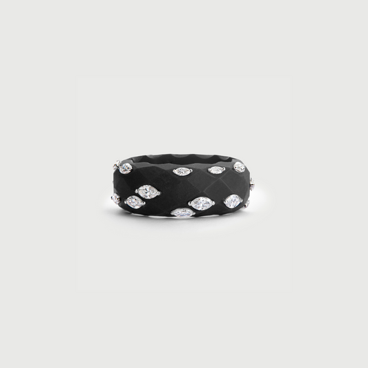 Black ring with embedded diamonds on a light gray background