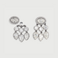 Pair of chandelier earrings with clear gemstones on a light gray background
