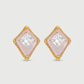 Pair of diamond-shaped earrings with pink centers and gold frames on a light gray background