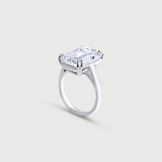 White gold ring with a large rectangular diamond on a light gray background