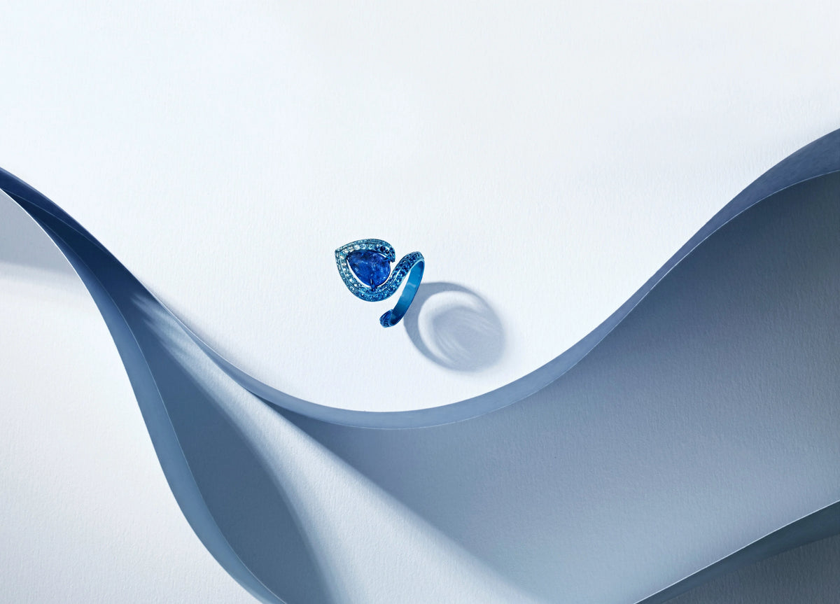 A blue teardrop-shaped ring